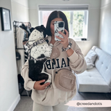 Mirror selfie with a dog and Teddy Rupert crossbody walking bag