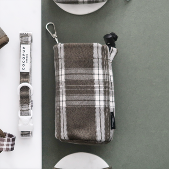 Olive Check drawstring treat pouch viewed straight from above beside a matching collar