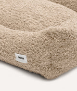 Close-up of beige fleece fabric and CAFIDE label