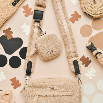 Teddy Rupert treat pouch by Cocopup London attached to a matching bag strap in a flat lay