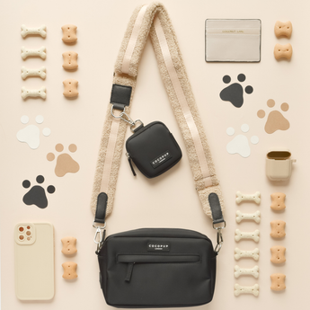 Teddy Rupert bag strap with two black Cocopup London bags and walking accessories