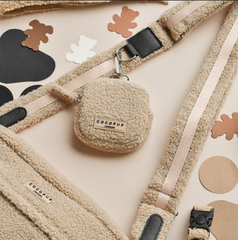 Close flat lay of the Teddy Rupert treat pouch clipped to a matching bag strap