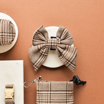 Pup Plaid Sailor Bow Tie above the matching poop bag holder in a flat lay