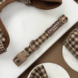 Cotswolds Check dog collar laid flat, showing buckle, adjuster, D-ring and brand label