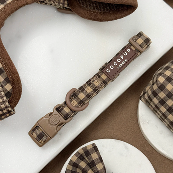 Cotswolds Check dog collar laid flat, showing buckle, adjuster, D-ring and brand label