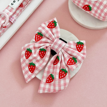 Strawberry Picnic Pup Sailor Bow Tie in a pink product flat lay