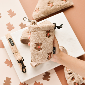 Hand holding Theo Embroidered Teddy treat pouch, showing teddy texture and small embroidered bears