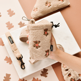 Hand holding Theo Embroidered Teddy treat pouch, showing teddy texture and small embroidered bears
