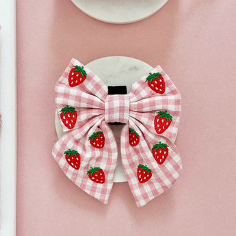Front flat lay of the pink gingham Strawberry Picnic Pup bow tie