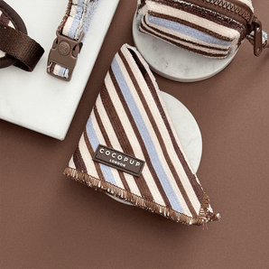 Folded Cocopup London Brown & Blue Stripes bandana on a round stone styling tile