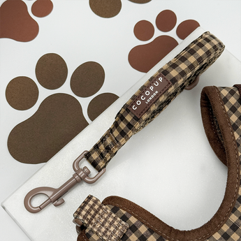 Cotswolds Check dog lead coiled in a flat lay, showing padded handle and silver swivel clip