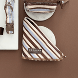 Folded Brown & Blue Stripes bandana showing striped towel texture and Cocopup London label