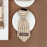 Front view of the London Linen Stripes Dog Tie on a white dish, by Cocopup London