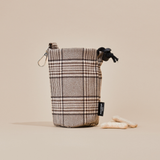 Pup Plaid drawstring treat pouch standing upright against a neutral backdrop