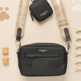 Teddy Rupert bag strap attached to a black Cocopup London dog walking bag
