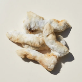 Rabbit feet with fur on a neutral background