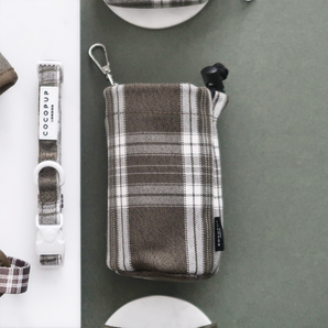 Olive Check drawstring treat pouch viewed straight from above beside a matching collar