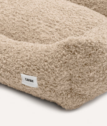 Close-up of beige fleece fabric and CAFIDE label