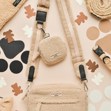 Teddy Rupert treat pouch by Cocopup London attached to a matching bag strap in a flat lay