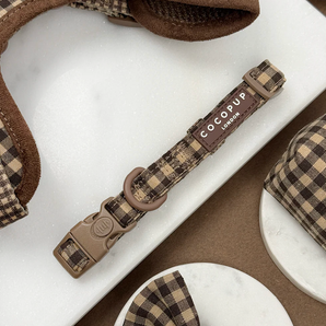 Cotswolds Check dog collar laid flat, showing buckle, adjuster, D-ring and brand label
