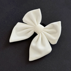 Cocopup London White Luxe Velvet Sailor Bow Tie angled on a dark background