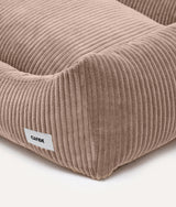 Close-up of mocha beige corduroy fabric and CAFIDE label