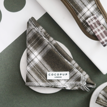 Front view of the folded Cocopup London Olive Check Bandana with the brand label visible