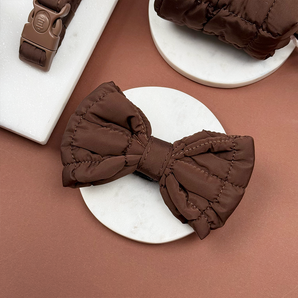 Cocopup London Espresso Quilted Bow Tie angled on a white dish in a brown flat lay