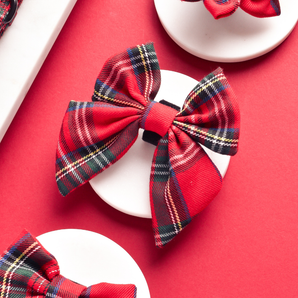Red and black Tartan Sailor Bow Tie by Cocopup London in a red product flat lay