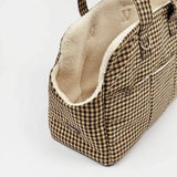 Close side view of Cotswold Check carrier showing cream Borg lining and exterior pocket