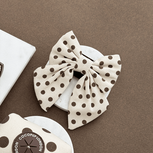 Tiramisu Polka Dot Sailor Bow Tie by Cocopup London in a neutral flat lay