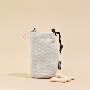 Cocopup London Brown Tweed drawstring treat pouch upright, showing side clip and black cord